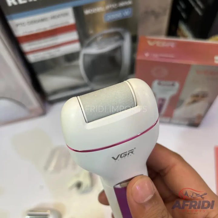 White and purple electric callus remover with a grey abrasive roller.
