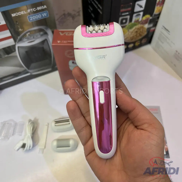 A white and pink electric epilator with multiple interchangeable heads.