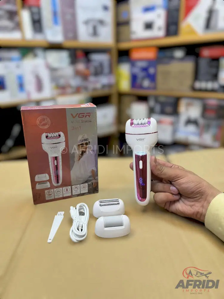 A white and pink electric epilator with multiple interchangeable heads and charging cable.