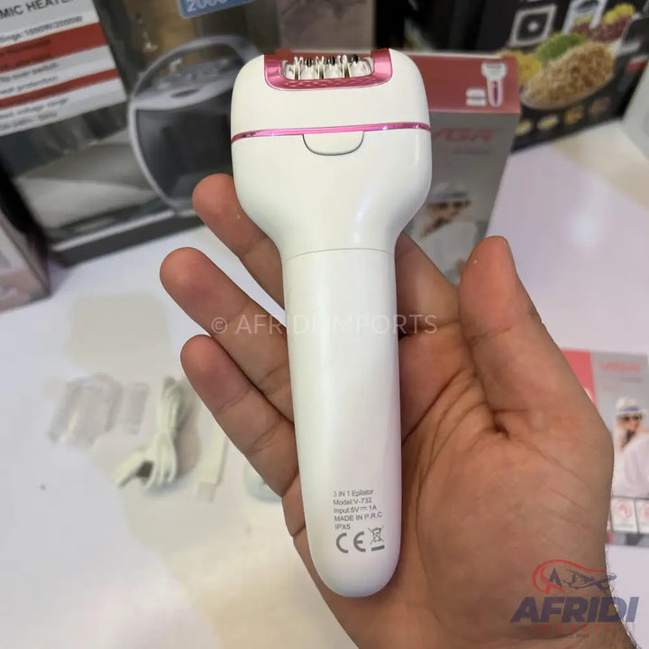 A white and pink electric epilator with multiple tweezers.
