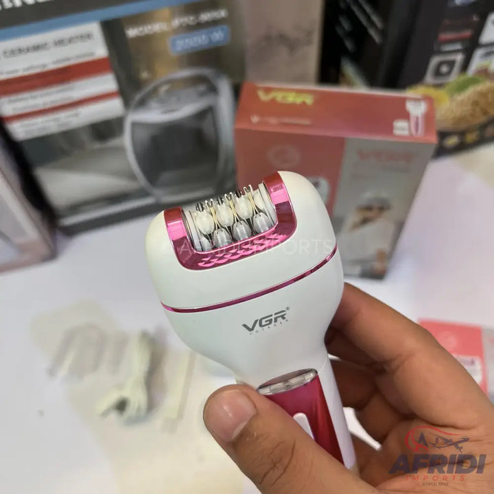 A white and pink electric epilator with a rotating head of tweezers.