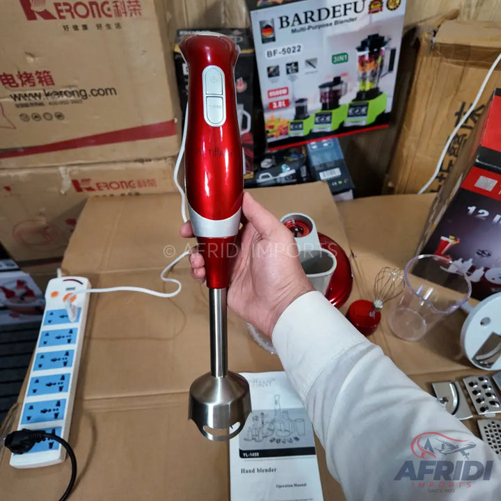 Red and silver handheld immersion blender with two control buttons.