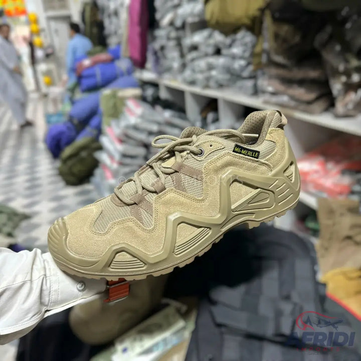Khaki brown athletic shoe with a rugged sole.