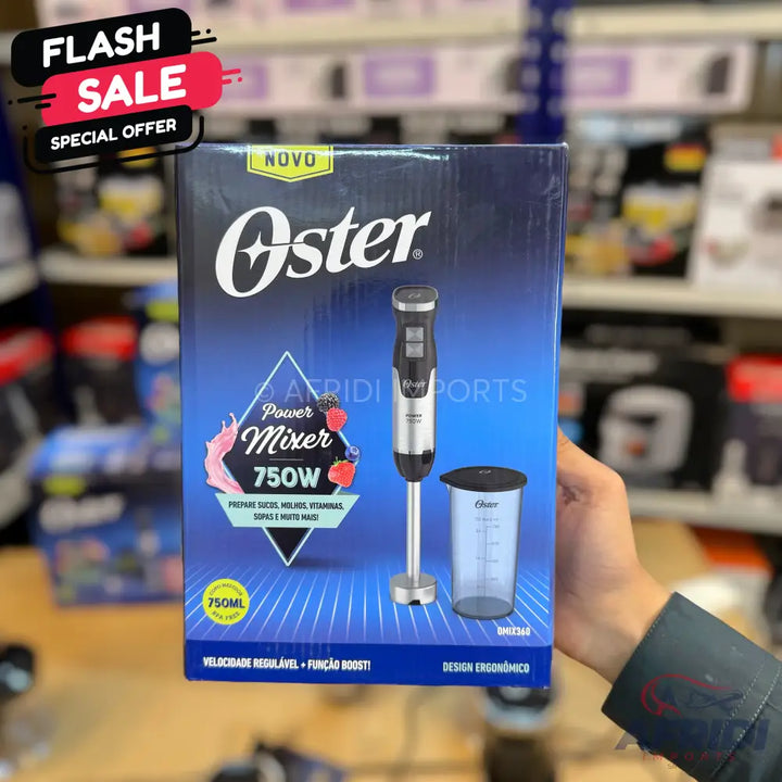 Oster Power Mixer 750W immersion blender with a measuring cup.