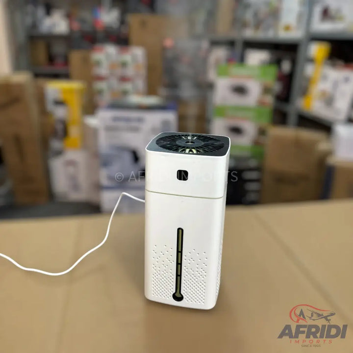 A white, rectangular air purifier or humidifier with a black top fan and a visible water level indicator.