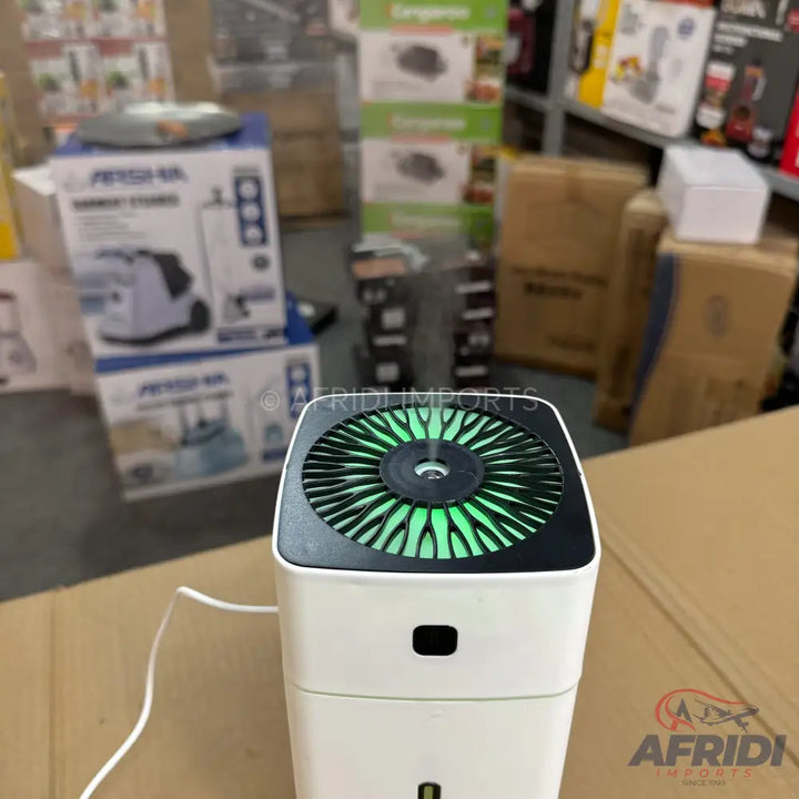 White portable air humidifier with a green-lit fan.