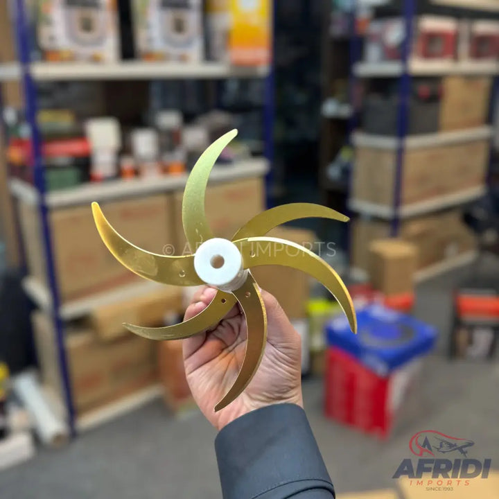 Six-bladed gold-colored propeller with a white hub.