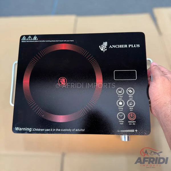 Black induction cooktop with touch controls and a circular heating zone.