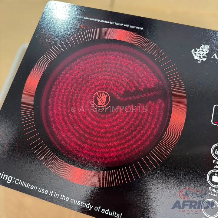 Black induction cooktop with a glowing red heating element.
