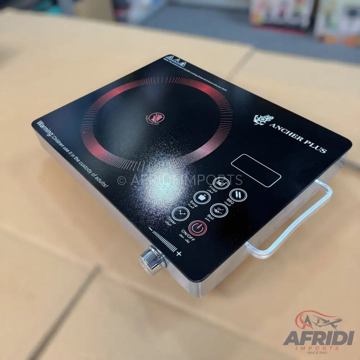 Black induction cooktop with touch controls and a single cooking zone.