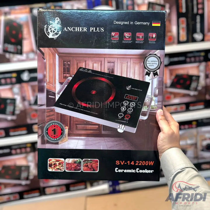 Black ceramic cooker with a single burner and digital controls.