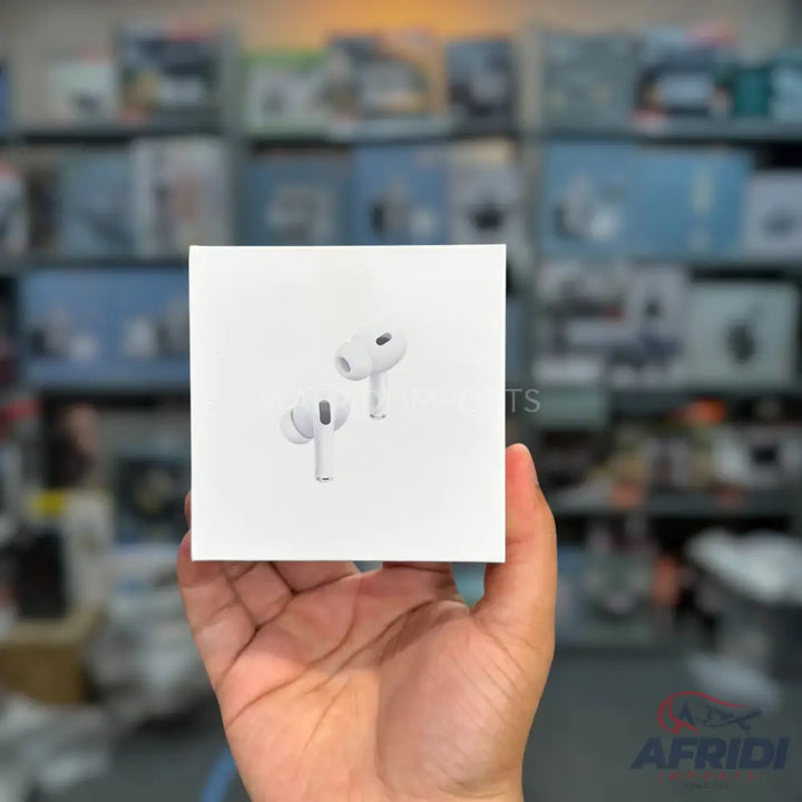 A white box of Apple AirPods Pro (2nd generation) held in a hand.