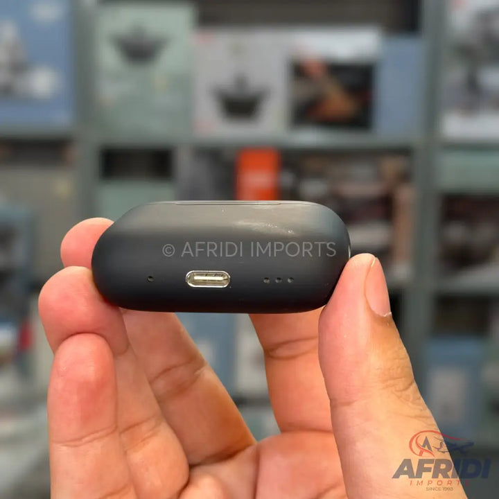A black wireless earbud charging case with a USB-C port.