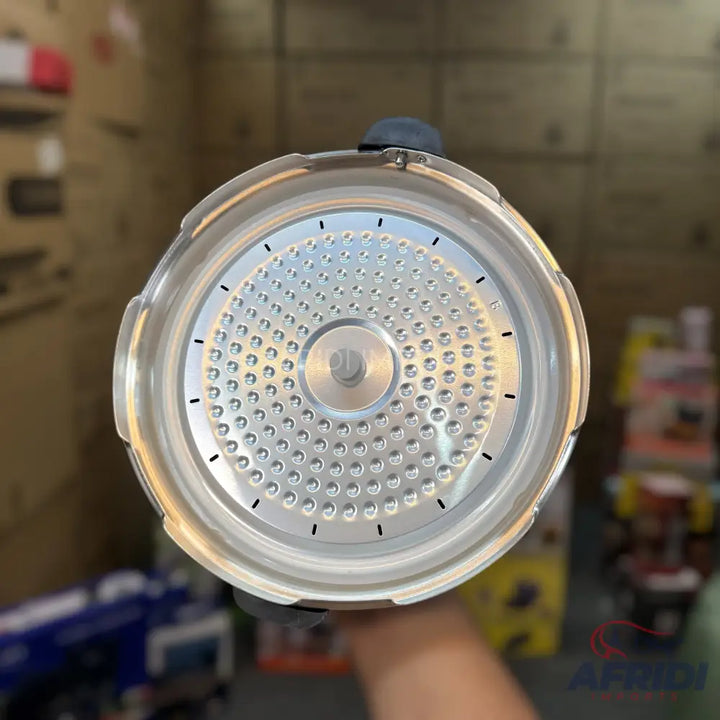 A metal coffee percolator basket with a perforated bottom and a central stem.