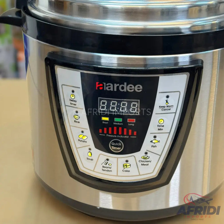 A modern stainless steel electric pressure cooker with a digital display and various cooking function buttons.