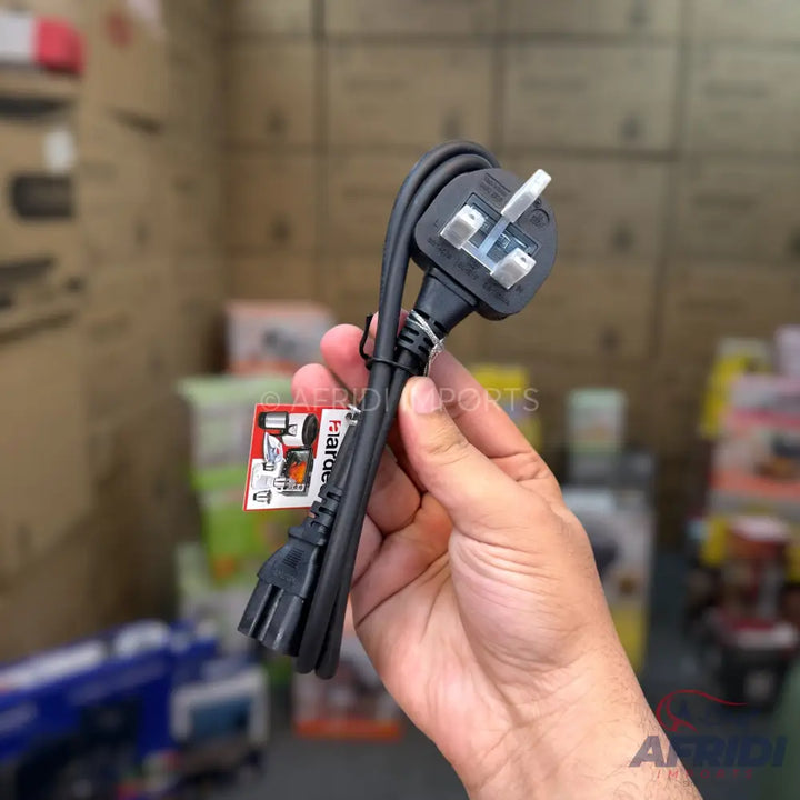 A black power cord with a UK-style three-pin plug on one end and a C13 connector on the other.