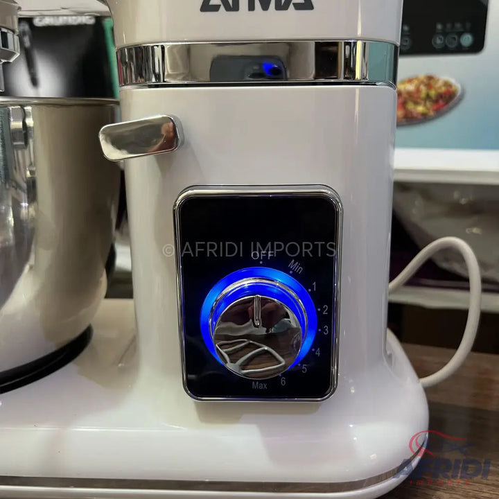 White stand mixer with a blue illuminated control dial.