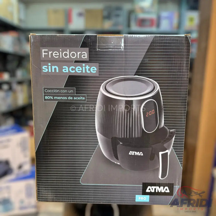 Packaged black air fryer with a digital display and removable basket.