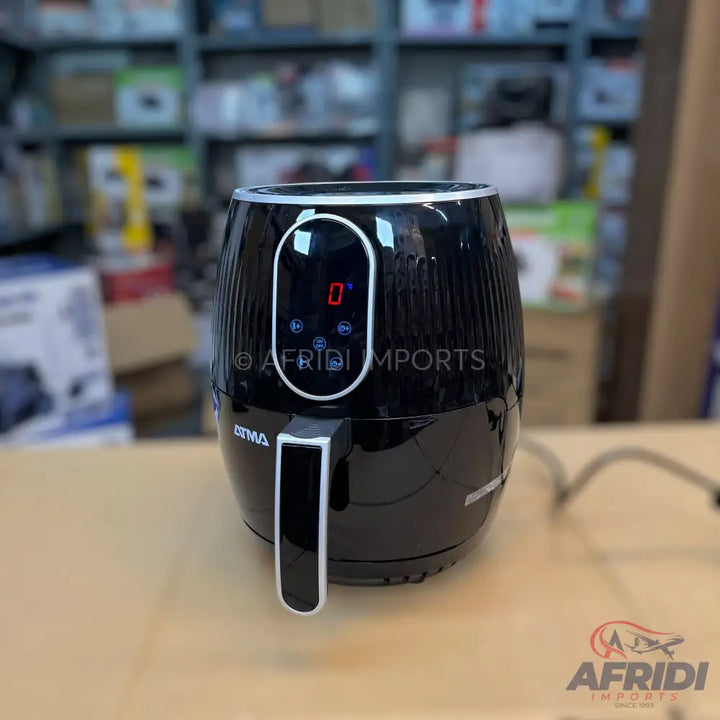 Black air fryer with a digital display and a handle.