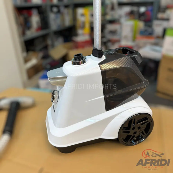 White and black garment steamer with a clear water tank and black wheels.