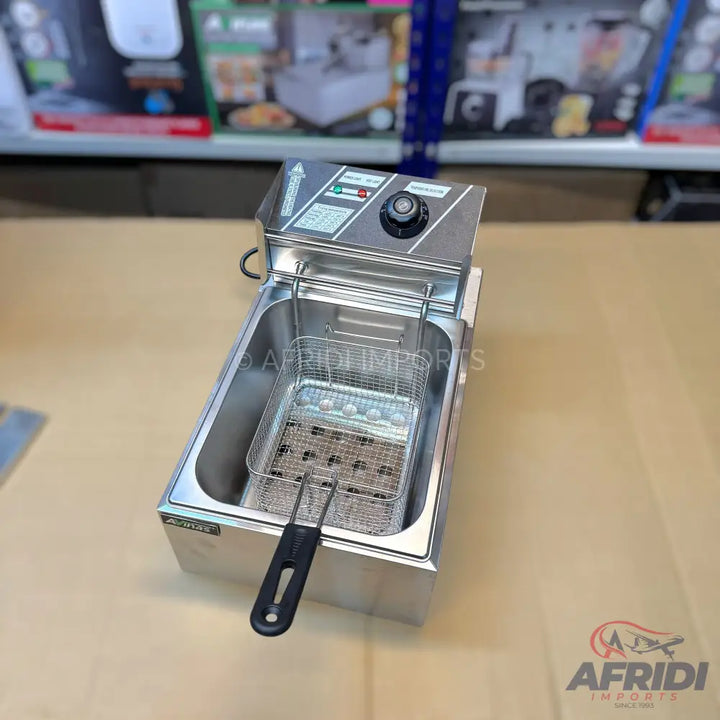 Stainless steel commercial deep fryer with a single basket and temperature control dial.