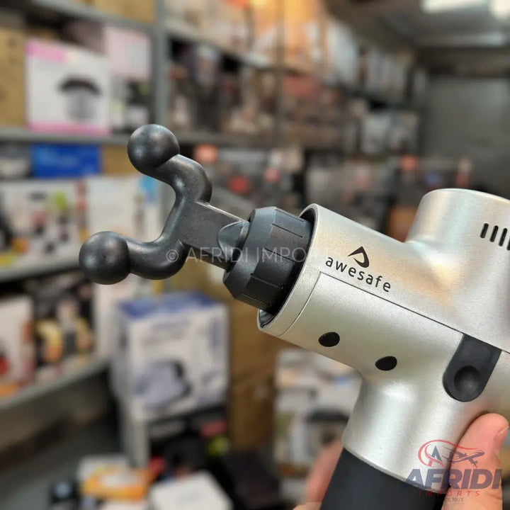 Silver and black percussive massage gun with a unique dual-ball attachment.