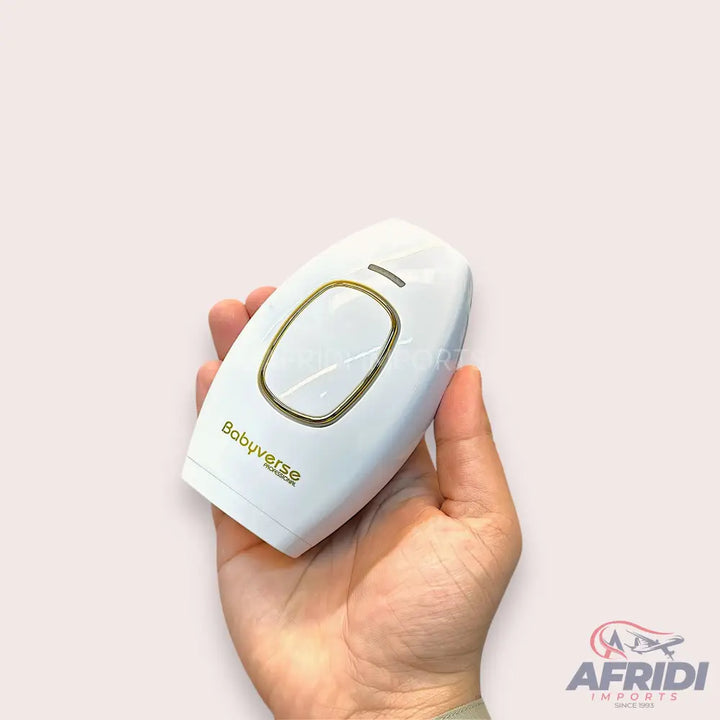 White handheld IPL hair removal device with a gold-trimmed treatment window.
