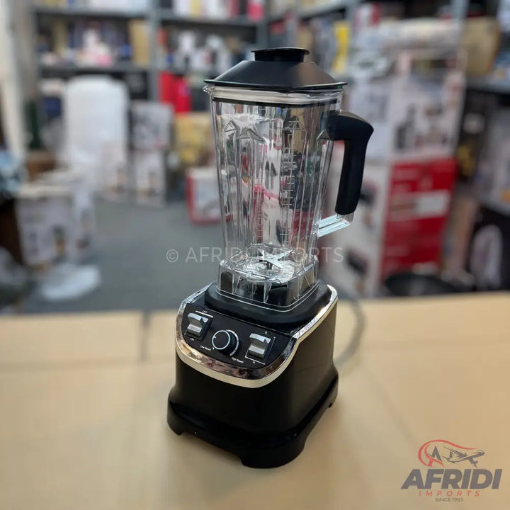 Black kitchen blender with a clear pitcher, a black lid, and silver-accented controls.