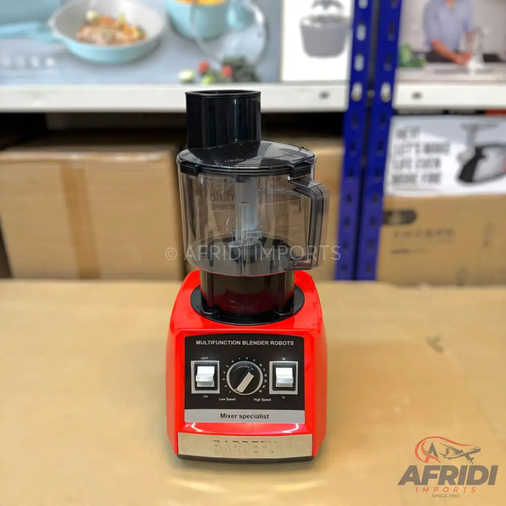 Red multi-function blender with a clear plastic mixing cup and black lid.