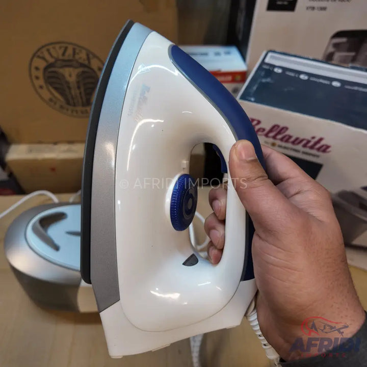 White and blue steam iron with a comfort grip handle.