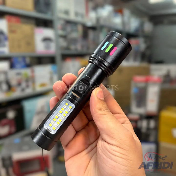 A black, dual-light-source flashlight with colorful indicator lights.