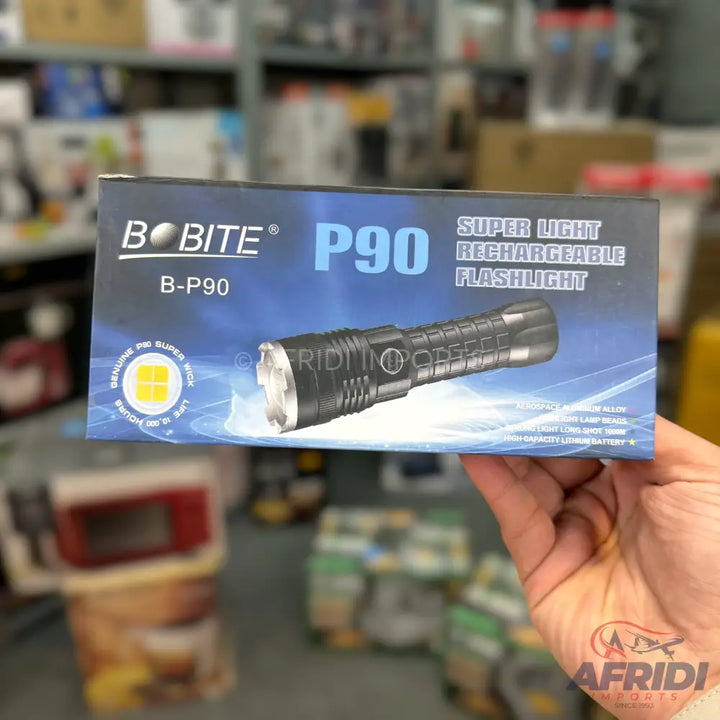 A black rechargeable LED flashlight in its retail box.