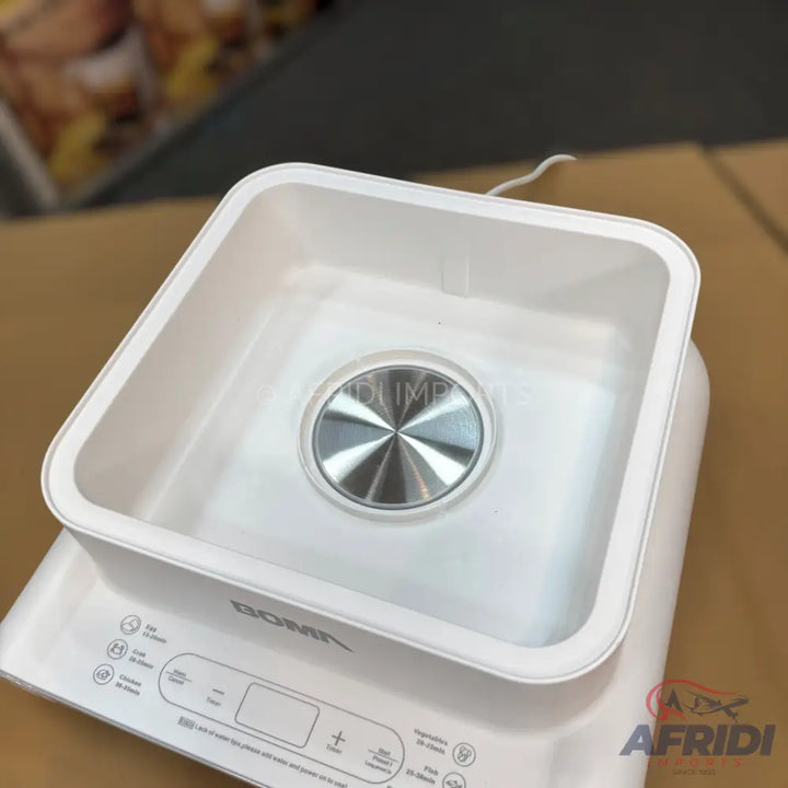 White square-shaped food sterilizer with a metallic center and control panel.