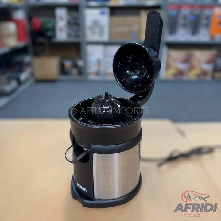 Black and silver electric citrus juicer with an open lid.