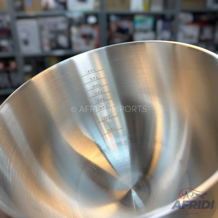 Stainless steel mixing bowl with internal volume markings.