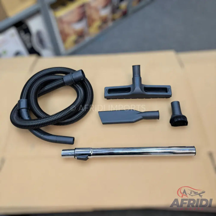 A set of black and silver vacuum cleaner attachments.