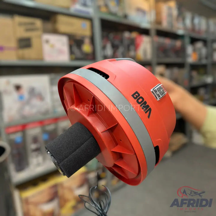 Red handheld vacuum cleaner with an attached filter.