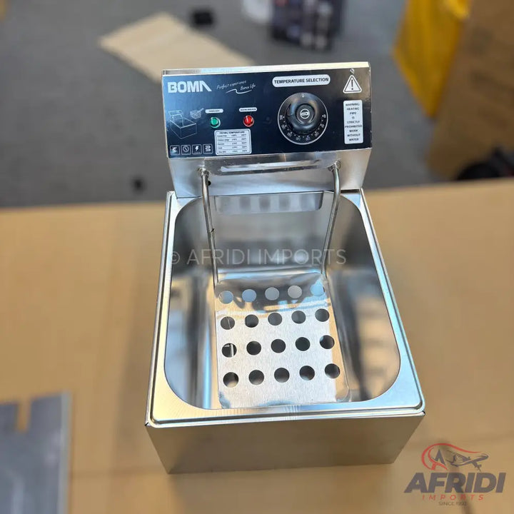 Stainless steel electric deep fryer with temperature control.
