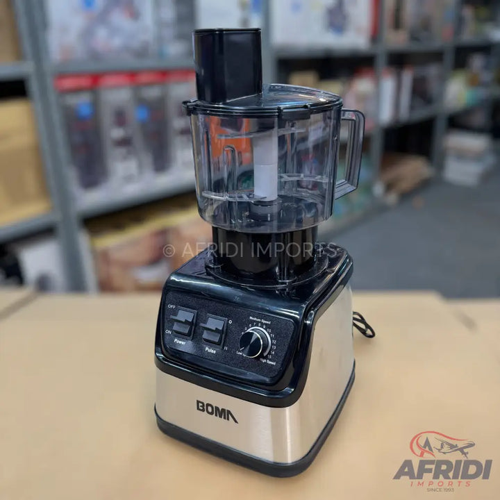 A black and silver food processor with a clear bowl, feed chute, and control panel.