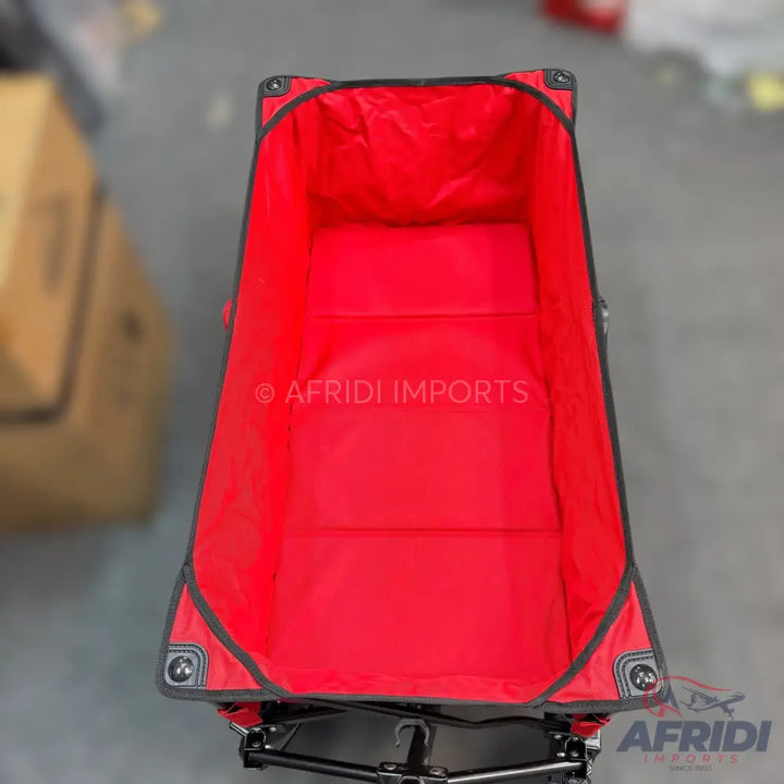 Red collapsible utility wagon with a black frame and trim.