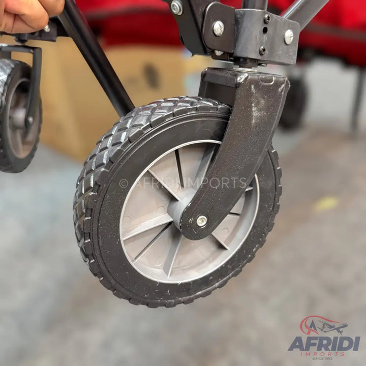 Black and gray heavy-duty caster wheel with a textured rubber tire.
