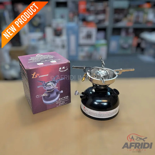 A black portable camping stove with a silver burner and pot support.