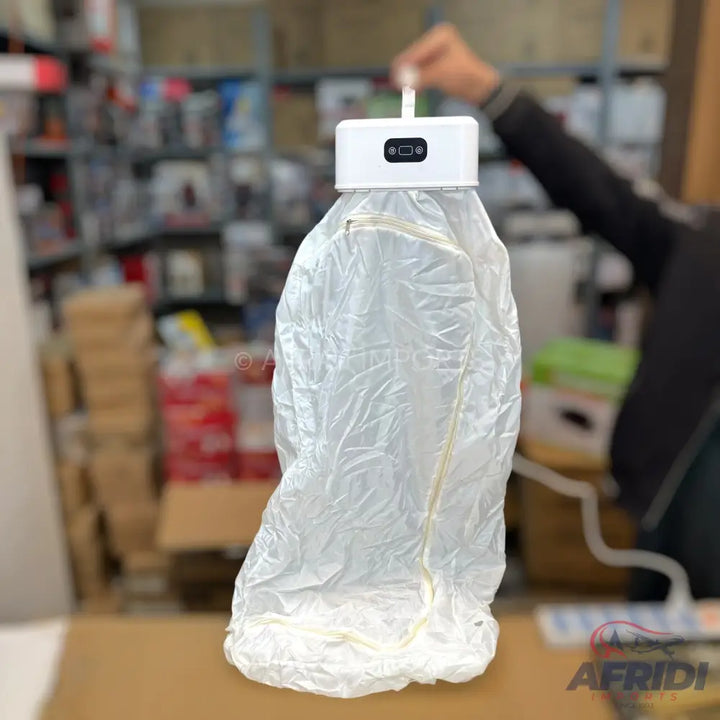 A portable white device with a clear plastic bag attached, possibly for sterilization or air purification.