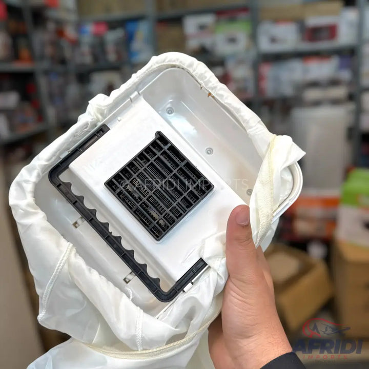 White fabric dust bag for a vacuum cleaner, with a rigid plastic frame and a black gridded filter.