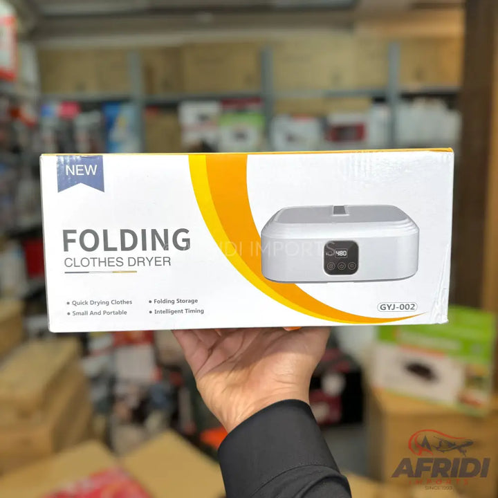 A white box for a folding clothes dryer, featuring an image of the device and key features like quick drying, folding storage, small and portable design, and intelligent timing.