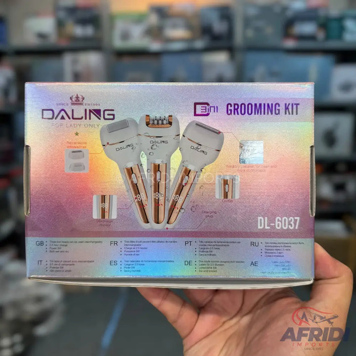 A white and rose gold grooming kit with three interchangeable heads for shaving, trimming, and exfoliating.