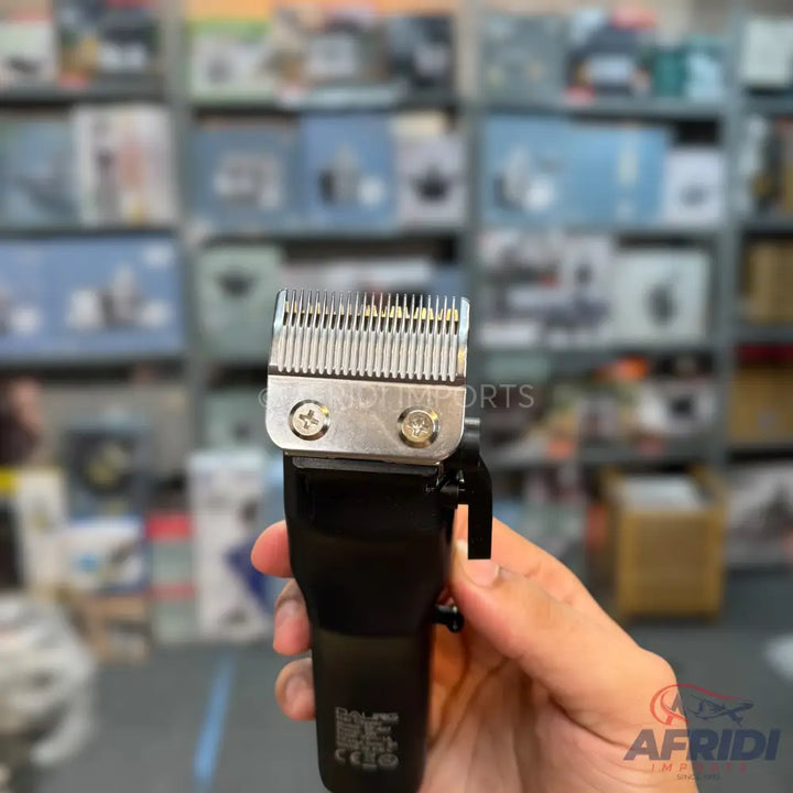 Black hair clipper with a silver blade and adjustment lever.