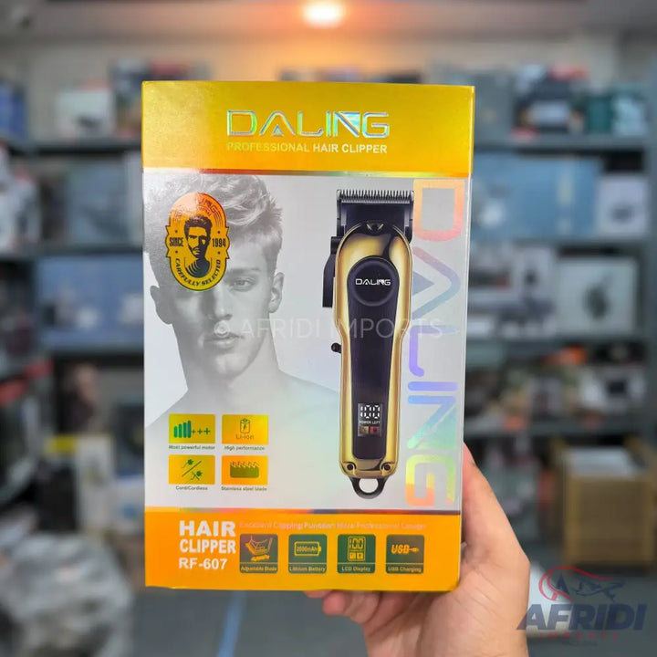 Gold and black professional hair clipper with an LCD display.