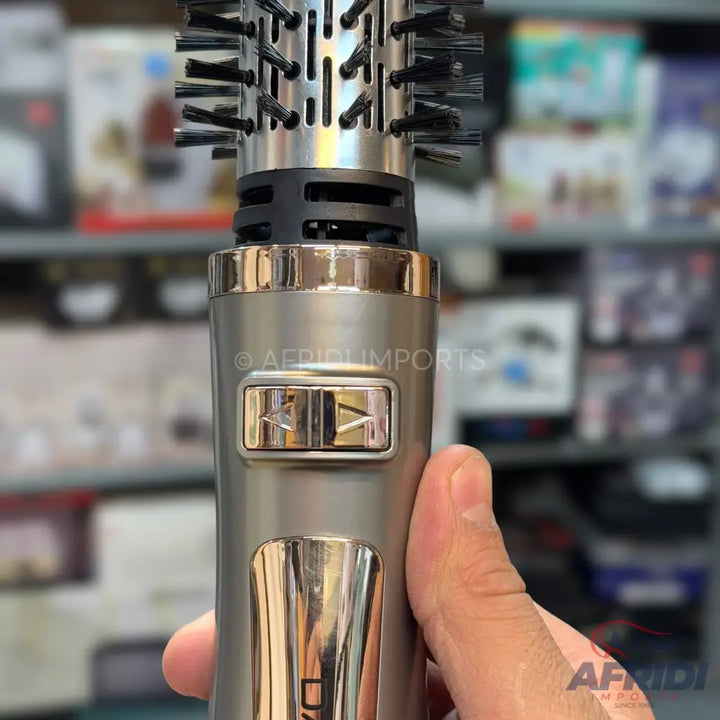 A rotating hot air brush for styling hair.