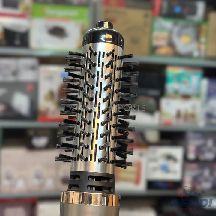 Silver and black round hot air brush with bristles.